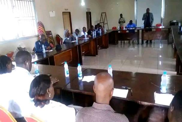 Public awareness meeting in a community hall in Sierra Leone