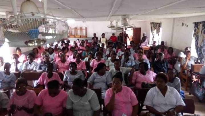 Community training session supporting the school fee subsidy monitoring activity